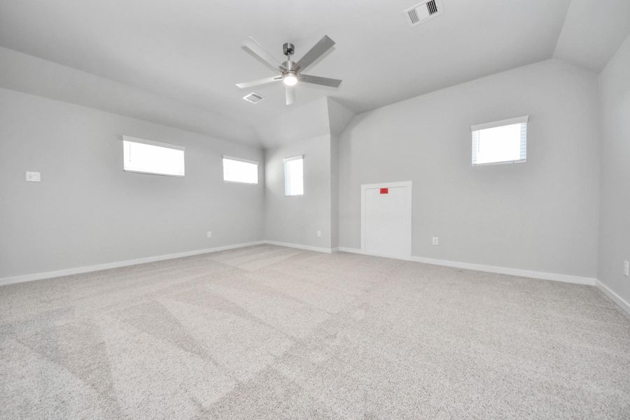 Discover a haven of leisure in this fantastic game room! Whether you're seeking a casual hangout or an adult gaming retreat, this space has it all. Enjoy the luxurious feel of plush carpet underfoot, the expansive ambiance of high ceilings, custom paint that adds a touch of personality, and windows that flood the room with refreshing natural light. Sample photo of completed home with similar floor plan. Actual colors and selections may vary. Discover a haven of leisure in this fantastic game room! Whether you're seeking a casual hangout or an adult gaming retreat, this space has it all. Enjoy the luxurious feel of plush carpet underfoot, the expansive ambiance of high ceilings, custom paint that adds a touch of personality, and windows that flood the room with refreshing natural light. Sample photo of completed home with similar floor plan. Actual colors and selections may vary.