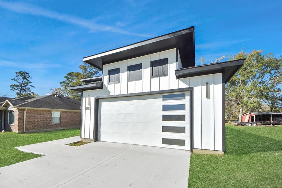 Front exterior of a new home in , Dayton, TX, highlighting curb appeal (Image 1). Front exterior of a new home in , Dayton, TX, highlighting curb appeal (Image 1).
