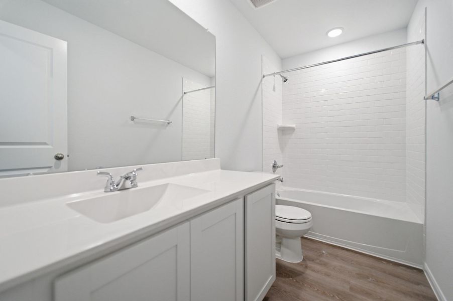 Furnished interior view inside a new home in The Pines at Seven Coves, Willis (Image 9).