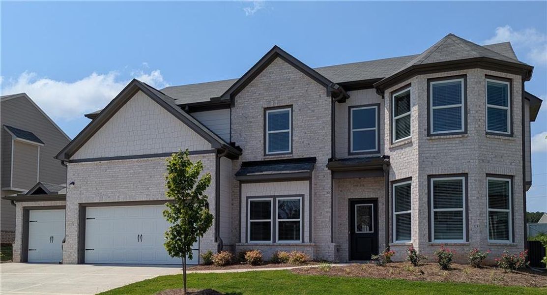 Front exterior of a new home in Beckett Ranch, Auburn, GA, highlighting curb appeal (Image 13).