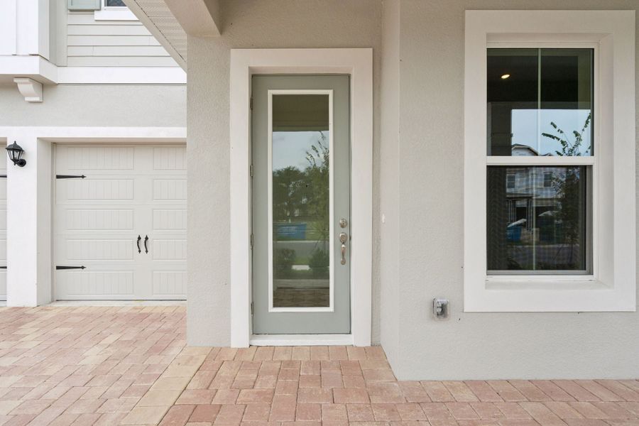 Exterior details and patio area of a home in Northlake at Ovation, Winter Garden (Image 3).