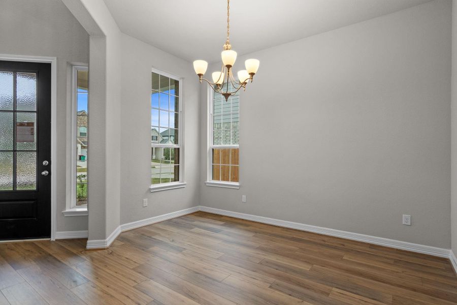 The dining area is a perfect blend of style and functionality, providing an inviting space for memorable meals and gatherings.