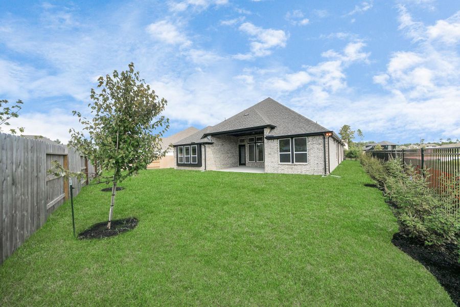 Front exterior of a new home in ARTAVIA: Hilltop Collection, Conroe, TX, highlighting curb appeal (Image 1). Front exterior of a new home in ARTAVIA: Hilltop Collection, Conroe, TX, highlighting curb appeal (Image 1).