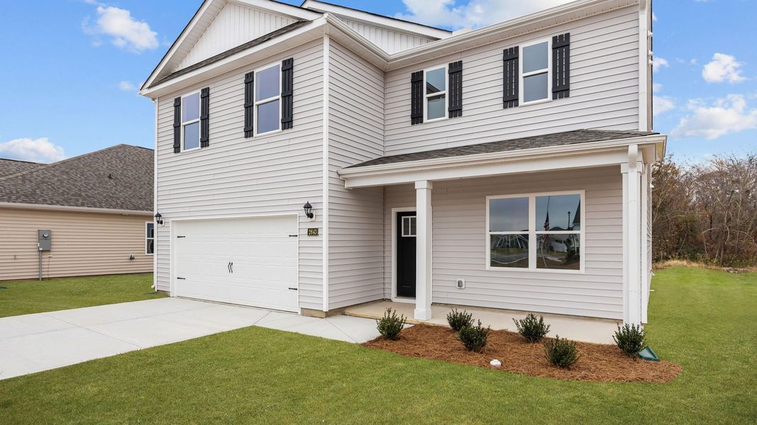 Front exterior of a new home in Villa Grande, Winterville, NC, highlighting curb appeal (Image 17). Front exterior of a new home in Villa Grande, Winterville, NC, highlighting curb appeal (Image 17).