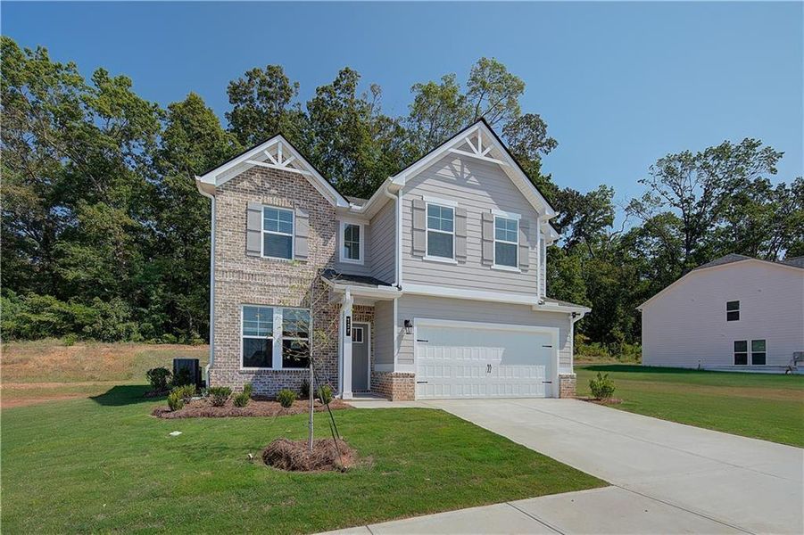 Front exterior of a new home in Westminster, Covington, GA, highlighting curb appeal (Image 1).
