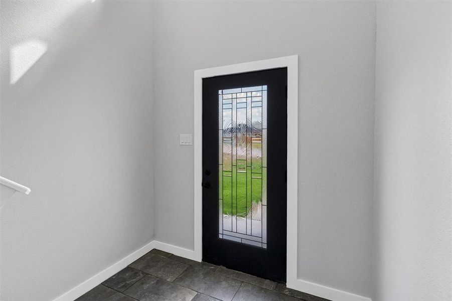 Foyer with baseboards