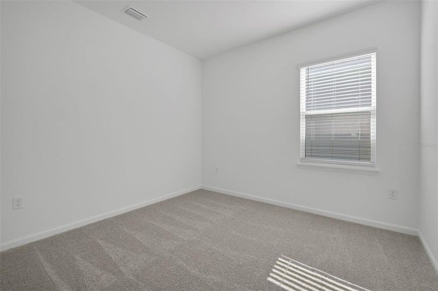 Spacious, unfurnished interior of a new home in Serenade at Ovation, Winter Garden (Image 24).