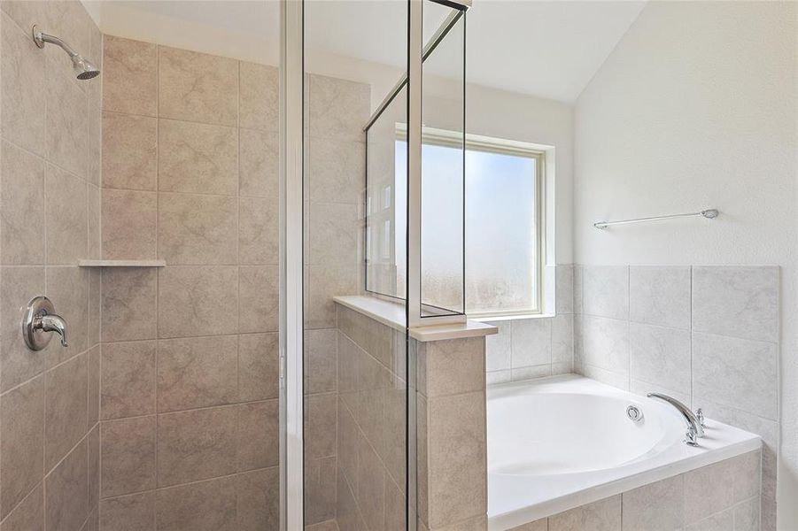 Bathroom with separate shower and tub and lofted ceiling