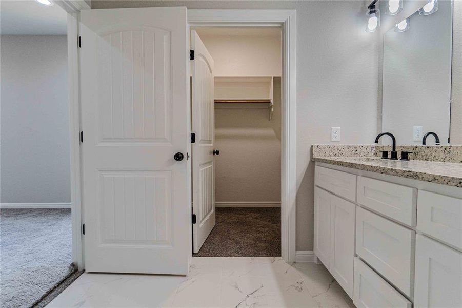 Bathroom featuring vanity and tile patterned flooring