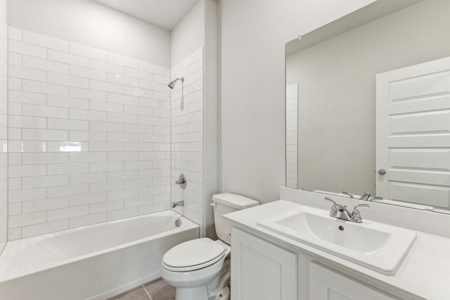 Bathroom in the Wimbledon home plan by Trophy Signature Homes – REPRESENTATIVE PHOTO Bathroom in the Wimbledon home plan by Trophy Signature Homes – REPRESENTATIVE PHOTO