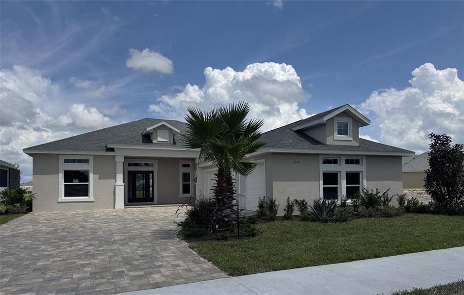 Front exterior of a new home in , Deland, FL, highlighting curb appeal (Image 1).