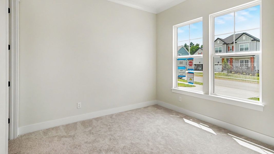 Secondary bathroom with carpet and windows Secondary bathroom with carpet and windows