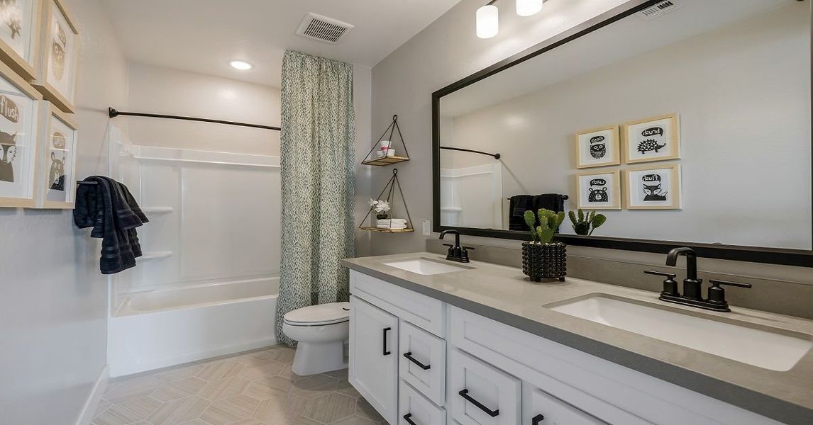 Representative furnished interior of a home built from the Camelback by William Ryan Homes in Alta Vida at Westpark, Buckeye (Image 27).