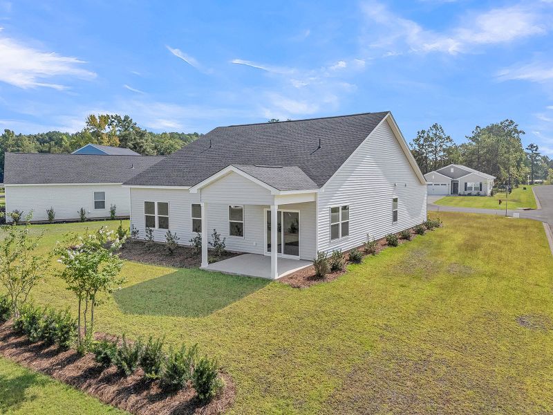 Exterior details and patio area of a home in Fairway Woods at Wyboo, Manning (Image 28).