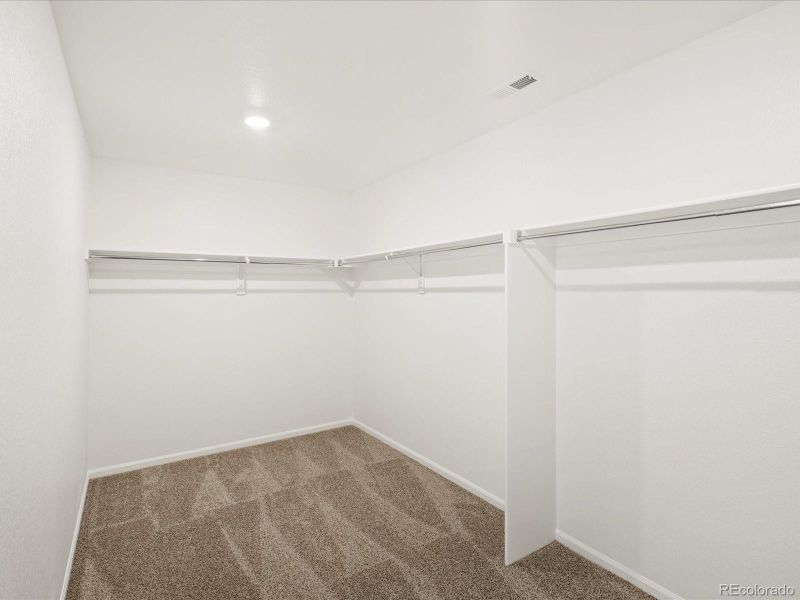 Spacious, unfurnished interior of a new home in Ridgeline Vista: The Flora Collection, Brighton (Image 30).