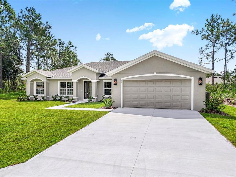 Front exterior of a new home in , Palm Coast, FL, highlighting curb appeal (Image 1).