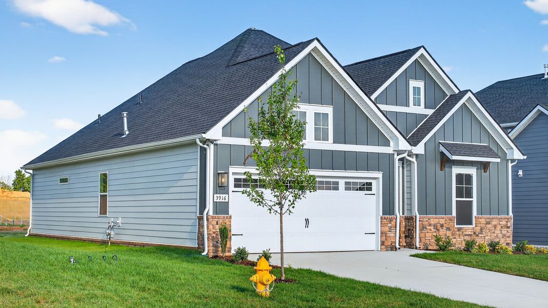 Front exterior of a new home in McClure Farms, Columbia, TN, highlighting curb appeal (Image 2).