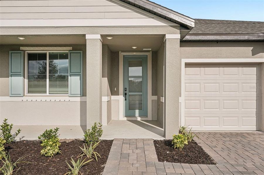 Exterior details and patio area of a home in Oakfield Trails - Signature Series, Parrish (Image 4).