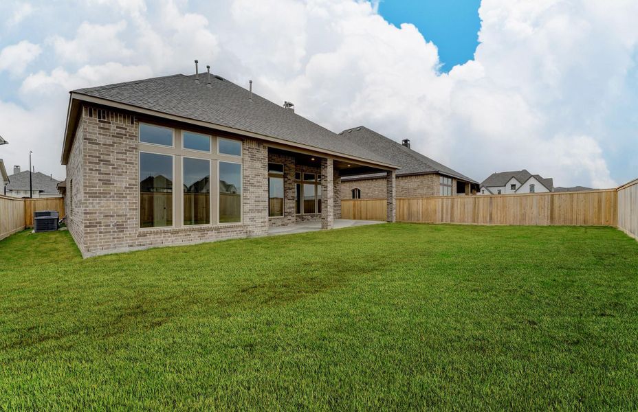 Exterior details and patio area of a home in The Woodlands Hills 65′, Willis (Image 26).