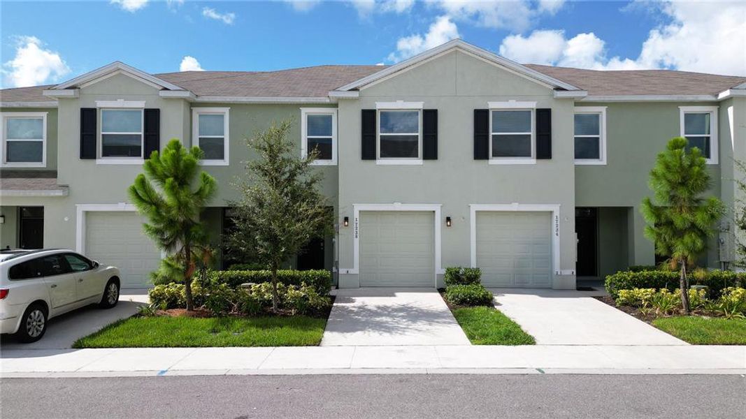 Front exterior of a new home in , Land O' Lakes, FL, highlighting curb appeal (Image 1). Front exterior of a new home in , Land O' Lakes, FL, highlighting curb appeal (Image 1).
