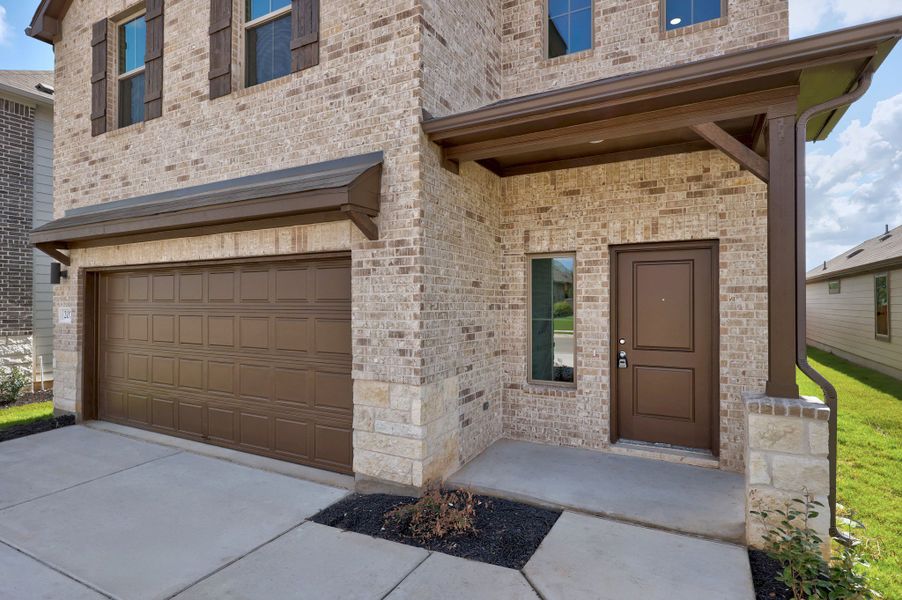 Exterior details and patio area of a home in Trinity Ranch, Elgin (Image 3).