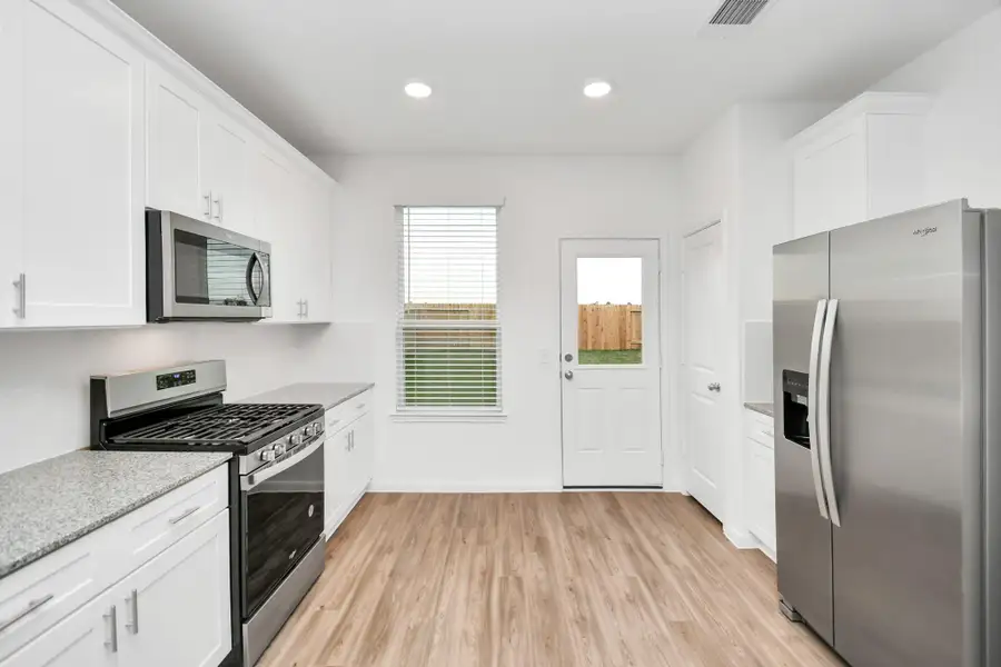Furnished interior view inside a new home in Decker Farms, Magnolia (Image 10).