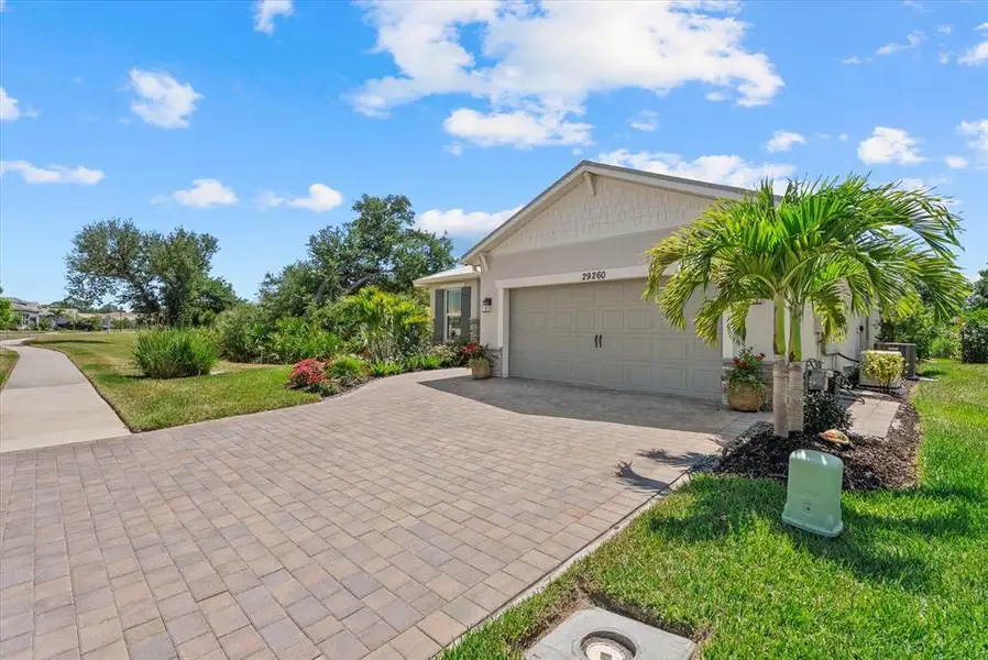 Front exterior of a new home in , Englewood, FL, highlighting curb appeal (Image 24).