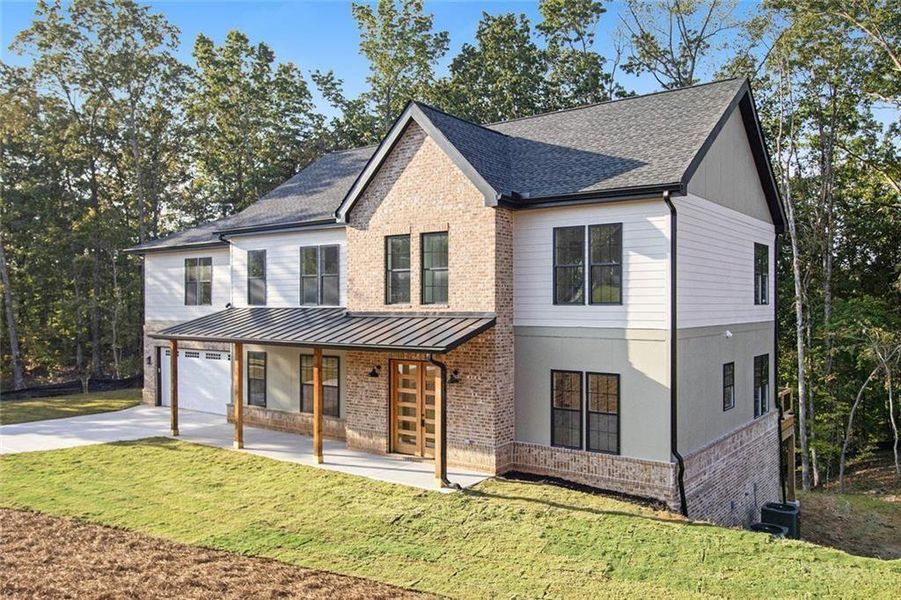 Front exterior of a new home in , Dawsonville, GA, highlighting curb appeal (Image 2). Front exterior of a new home in , Dawsonville, GA, highlighting curb appeal (Image 2).