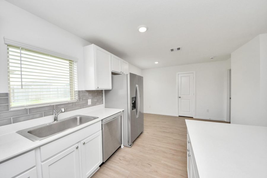 Plenty of workspace and storage throughout.