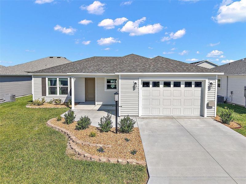 Front exterior of a new home in , The Villages, FL, highlighting curb appeal (Image 22). Front exterior of a new home in , The Villages, FL, highlighting curb appeal (Image 22).