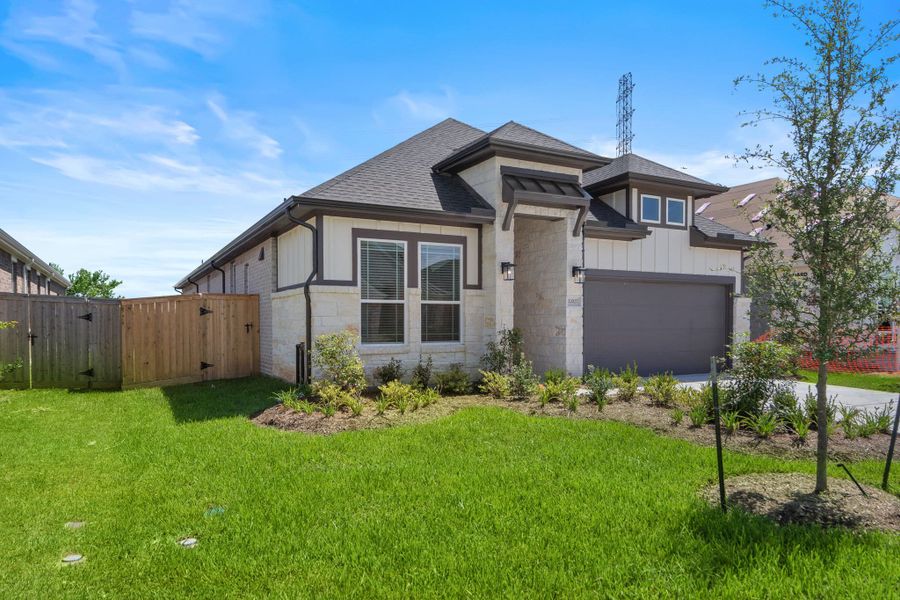 Front exterior of a new home in Mulberry Farms, Santa Fe, TX, highlighting curb appeal (Image 29).