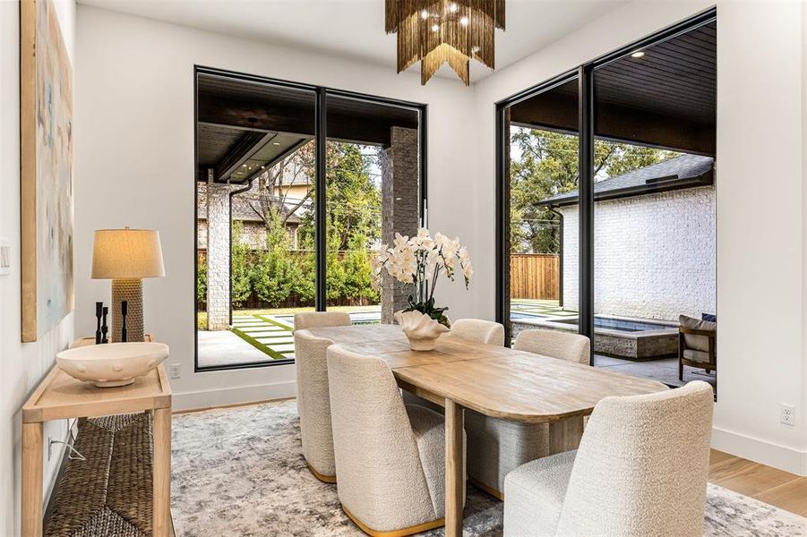 Positioned within the open layout, the dining space feels connected yet defined, with plenty of room for a statement table and chairs