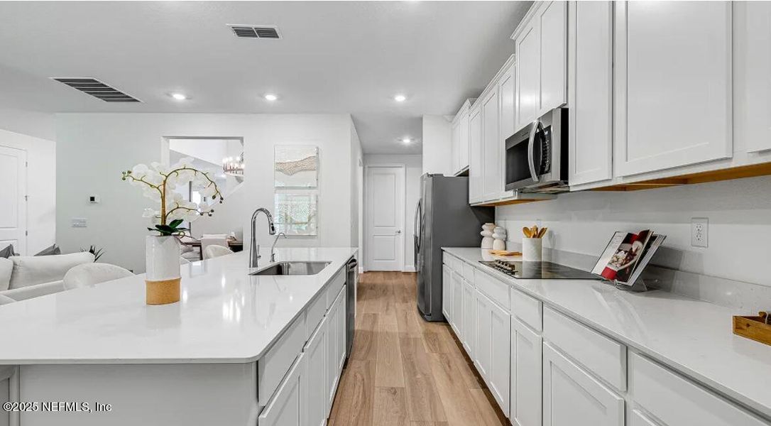 Furnished interior view inside a new home in Russell Retreat, Green Cove Springs (Image 12). Furnished interior view inside a new home in Russell Retreat, Green Cove Springs (Image 12).