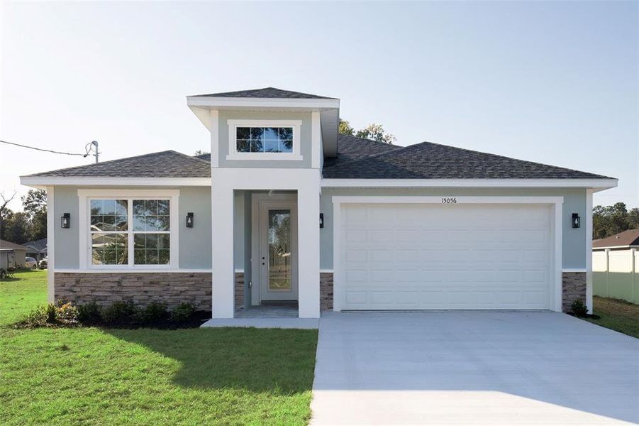 Front exterior of a new home in , Summerfield, FL, highlighting curb appeal (Image 28).