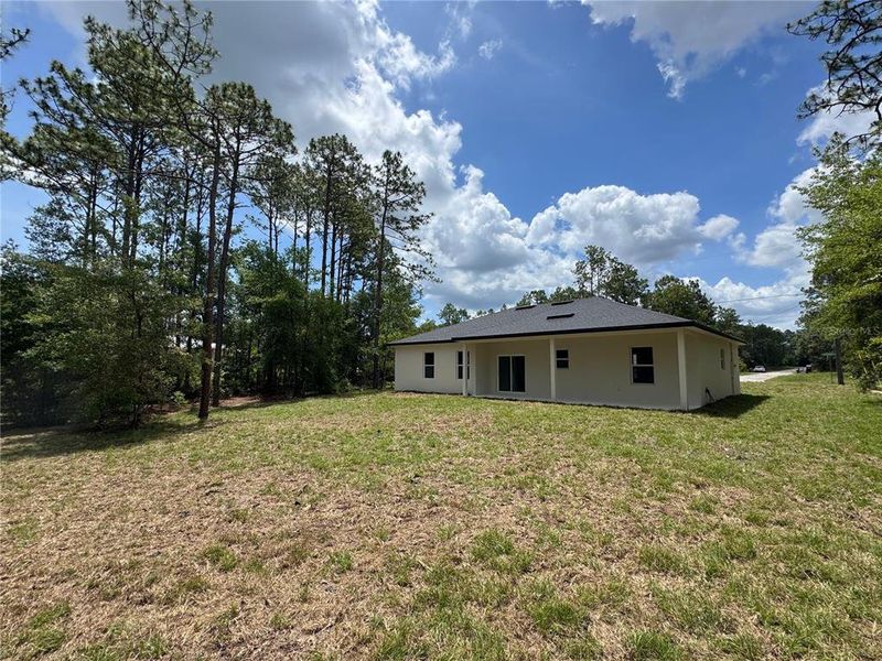 Exterior details and patio area of a home in , Citrus Springs (Image 3).