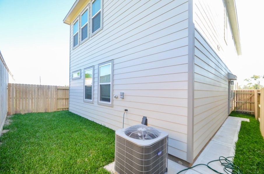 This spacious, fully fenced backyard with a well-maintained lawn is perfect for entertaining and relaxing.