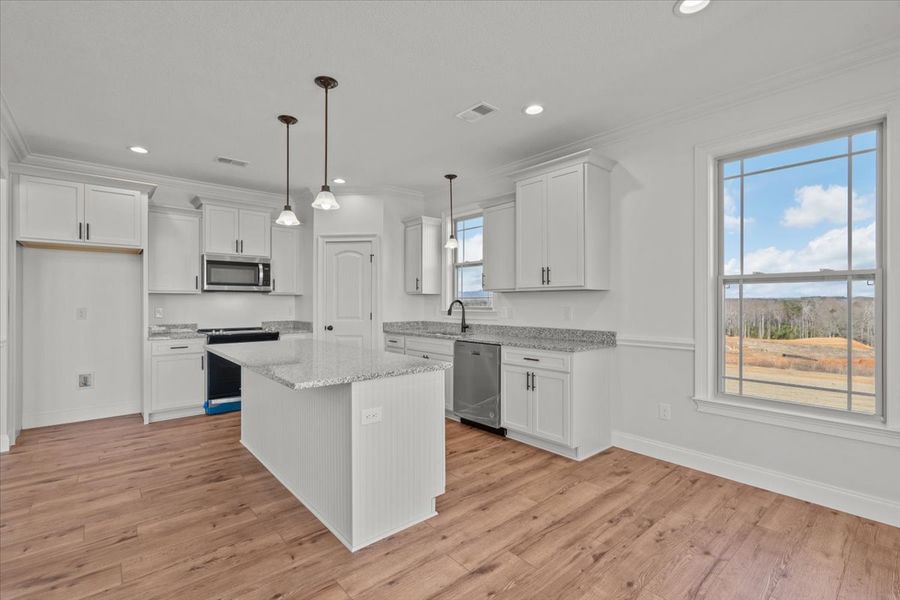 Representative furnished interior of a home built from the Converse by Enchanted Homes in Lonesome Dove, San Antonio (Image 9).