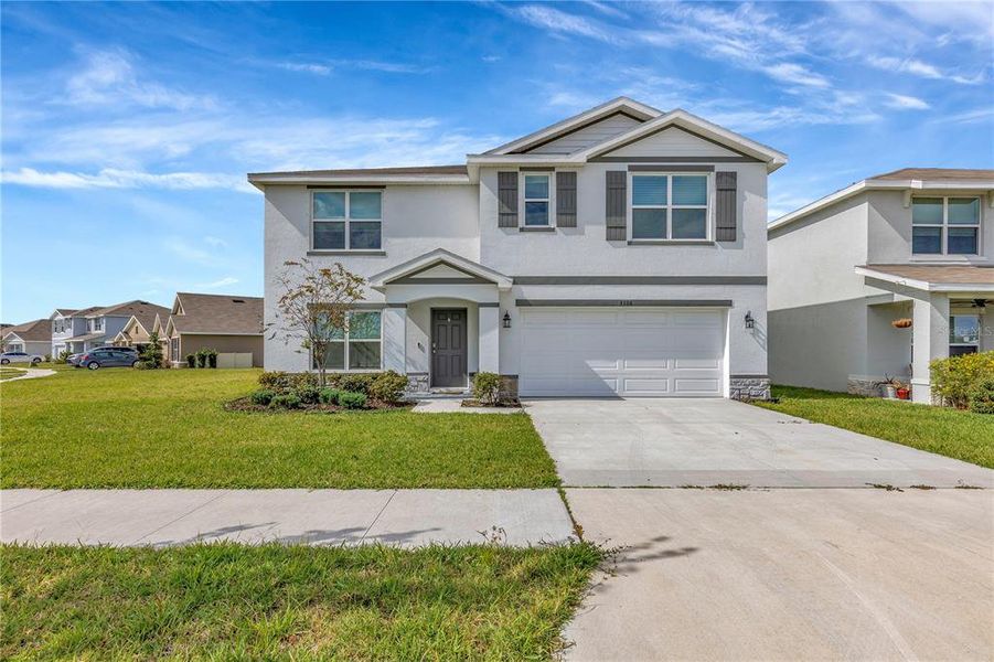 Front exterior of a new home in , Wimauma, FL, highlighting curb appeal (Image 1). Front exterior of a new home in , Wimauma, FL, highlighting curb appeal (Image 1).