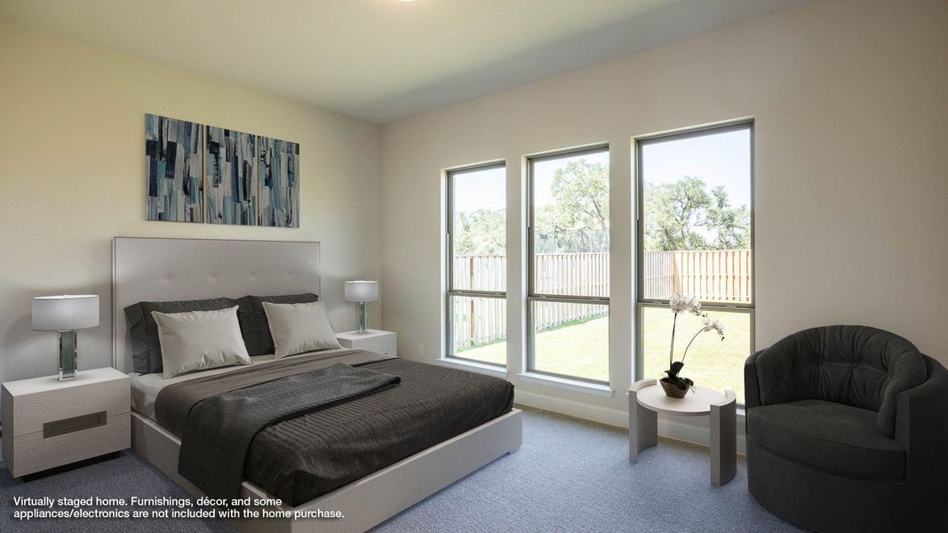 Carpeted bedroom featuring baseboards