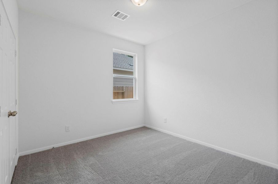 Your secondary bedroom features plush carpet, fresh paint, closet, and a large window that lets in plenty of natural lighting. Your secondary bedroom features plush carpet, fresh paint, closet, and a large window that lets in plenty of natural lighting.
