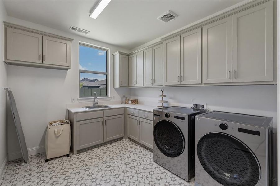 Huge laundry room with sink and space for extra refrigerator. Huge laundry room with sink and space for extra refrigerator.