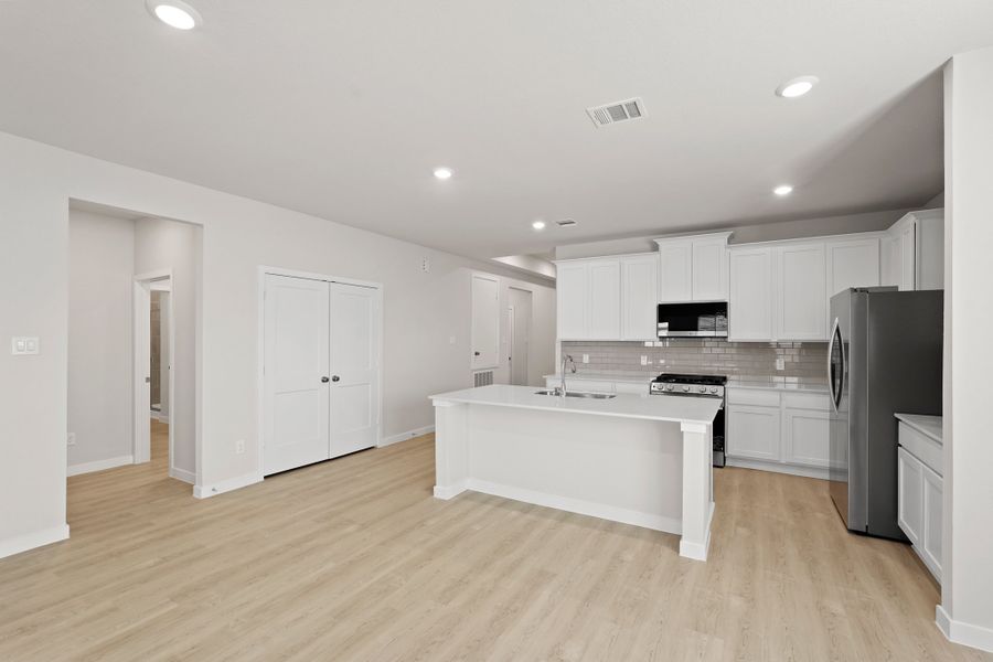 A kitchen with white cabinets. A kitchen with white cabinets.