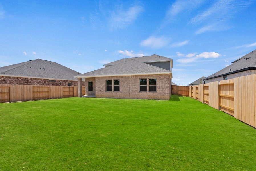 Exterior details and patio area of a home in Windcress, Cove (Image 24).