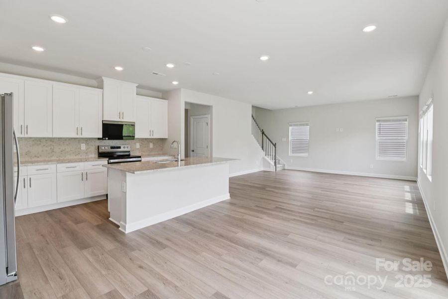 Furnished interior view inside a new home in Harper Landing, Stanley (Image 4).