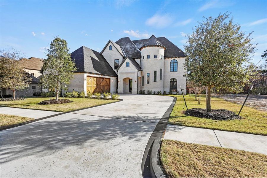 French provincial home with a front lawn