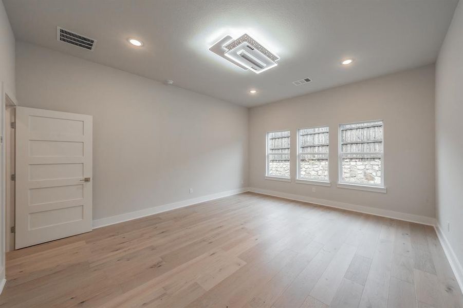 Unfurnished room featuring light wood finished floors and recessed lighting