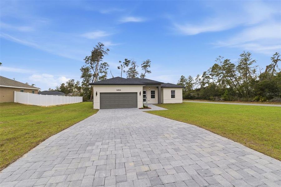 Front exterior of a new home in , Ocala, FL, highlighting curb appeal (Image 22).