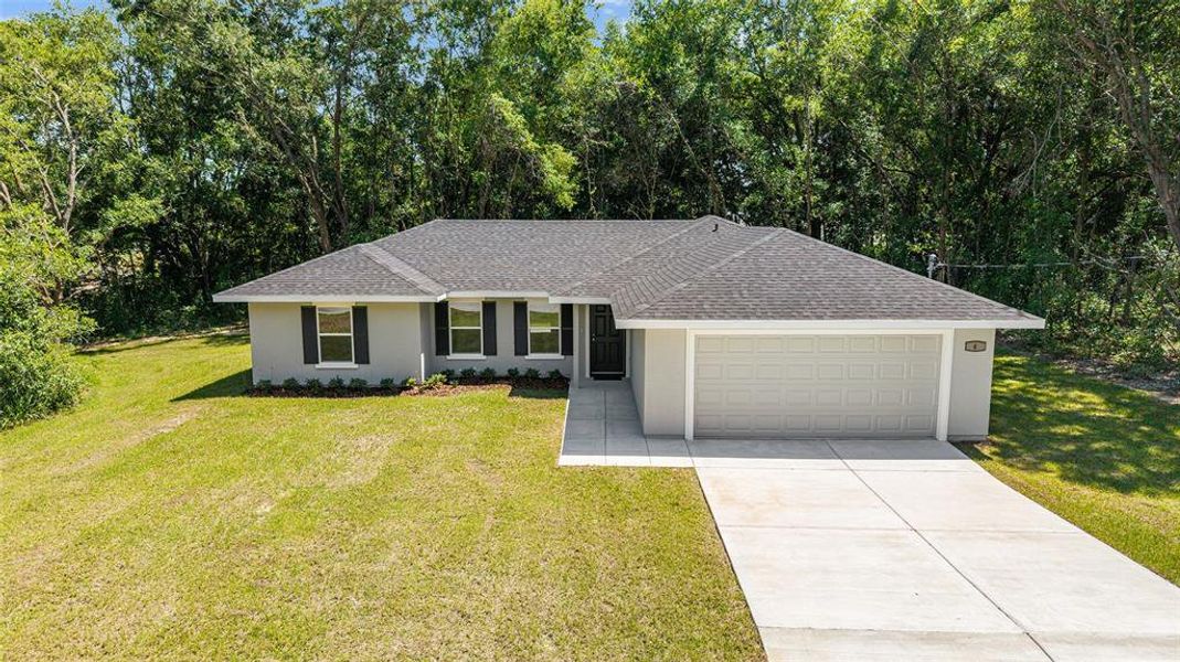 Front exterior of a new home in , Ocala, FL, highlighting curb appeal (Image 22).