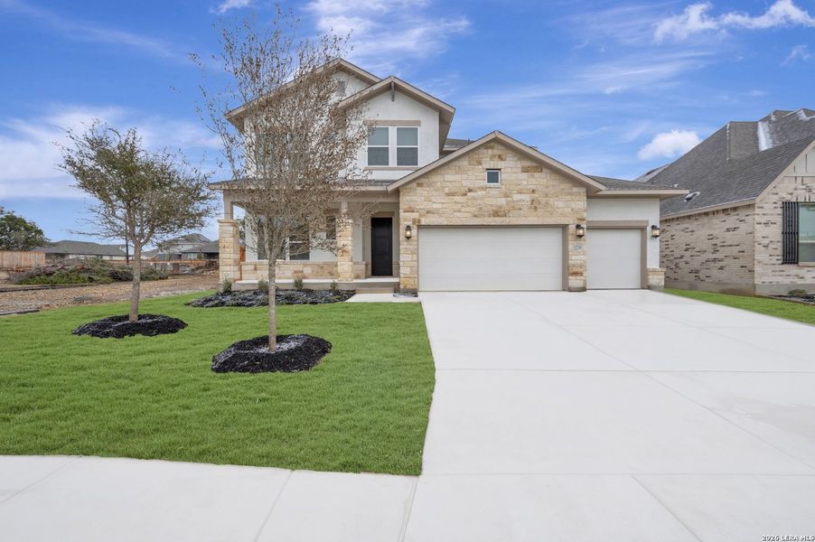 Front exterior of a new home in Davis Ranch 60', San Antonio, TX, highlighting curb appeal (Image 1). Front exterior of a new home in Davis Ranch 60', San Antonio, TX, highlighting curb appeal (Image 1).