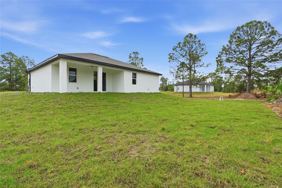 Exterior details and patio area of a home in , Lehigh Acres (Image 4).